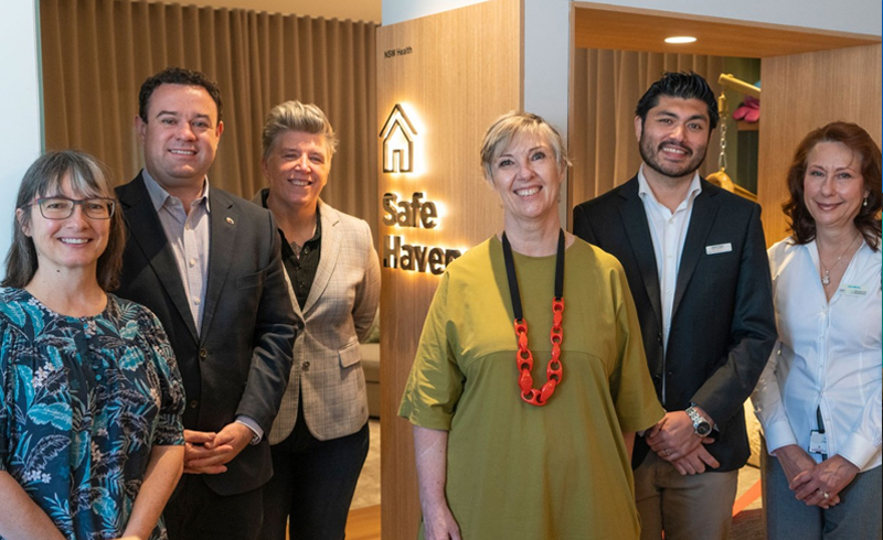 Safe Haven Launch with multiple people standing in front of Safe Haven sign