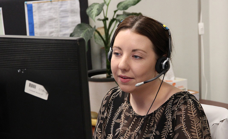 NDIS Intake- Lady taking phone call on headset