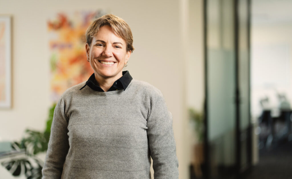 Ana Lopez smiles in the waiting room of Neami Western Sydney.